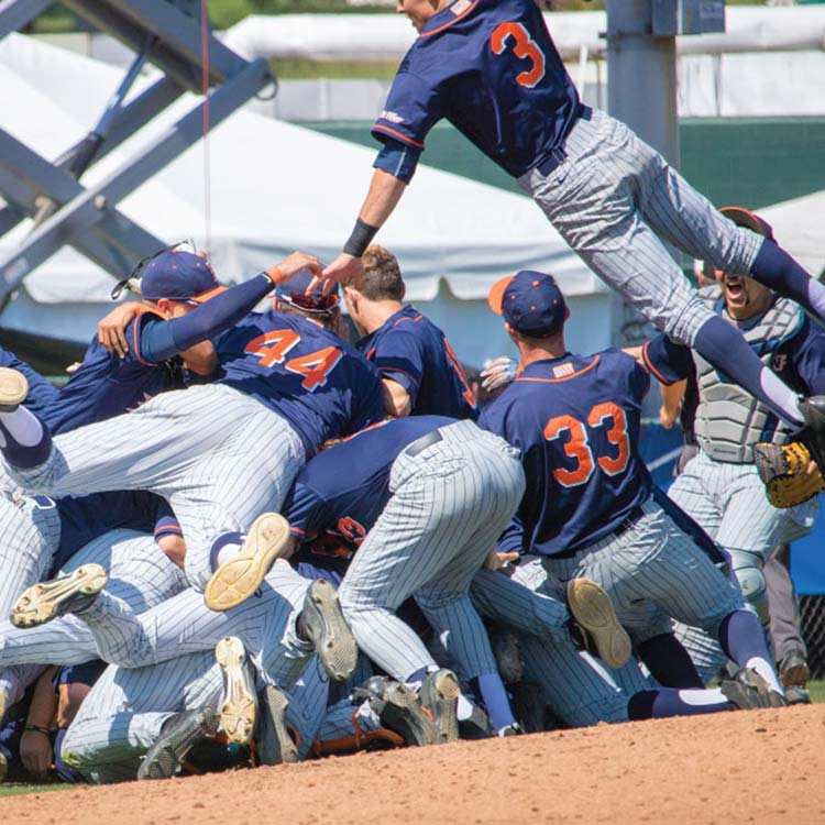 Cal State Fullerton baseball players celebrating on the field